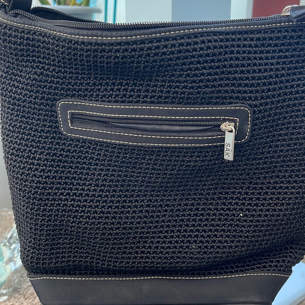 The Sak women’s black handbag outside zipper interior zipper pocket
